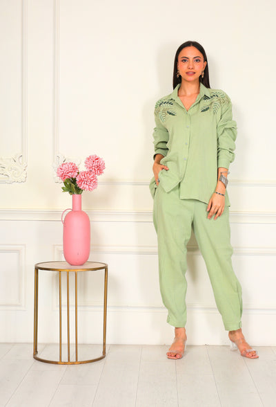 An ode to quiet luxury — our Reseda Reverie Coord Set blends crushed double georgette with fluid tailoring. Featuring hand-finished sequin, resham, and bead embroidery, this down-shoulder silhouette redefines ease with artistic precision and timeless poise.