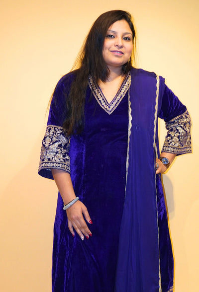 Velvet Majesty by Destiny by Anjali exudes luxury with premium velvet fabric and golden embroidery on the handcuffs and hem. Available in Royal Blue, Ebony Black, and Maroon, this elegant suit is perfect for weddings and festive occasions.&nbsp;