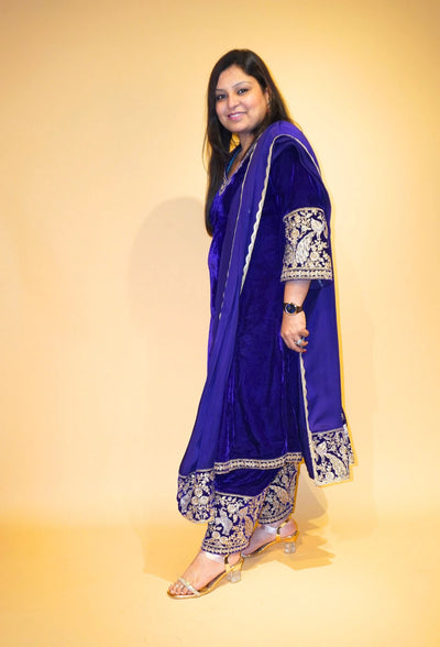 Velvet Majesty by Destiny by Anjali exudes luxury with premium velvet fabric and golden embroidery on the handcuffs and hem. Available in Royal Blue, Ebony Black, and Maroon, this elegant suit is perfect for weddings and festive occasions.&nbsp;
