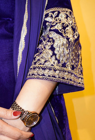Velvet Majesty by Destiny by Anjali exudes luxury with premium velvet fabric and golden embroidery on the handcuffs and hem. Available in Royal Blue, Ebony Black, and Maroon, this elegant suit is perfect for weddings and festive occasions.&nbsp;