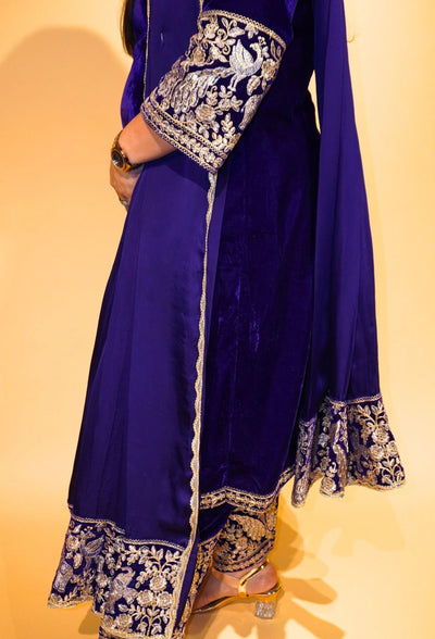 Velvet Majesty by Destiny by Anjali exudes luxury with premium velvet fabric and golden embroidery on the handcuffs and hem. Available in Royal Blue, Ebony Black, and Maroon, this elegant suit is perfect for weddings and festive occasions.&nbsp;