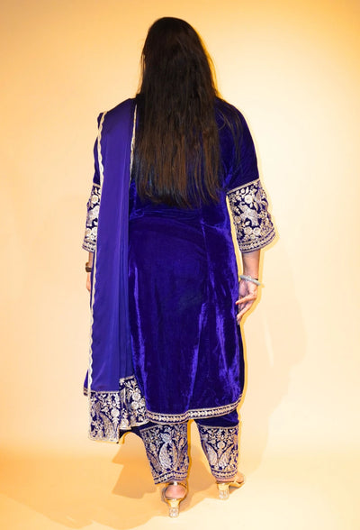 Velvet Majesty by Destiny by Anjali exudes luxury with premium velvet fabric and golden embroidery on the handcuffs and hem. Available in Royal Blue, Ebony Black, and Maroon, this elegant suit is perfect for weddings and festive occasions.&nbsp;