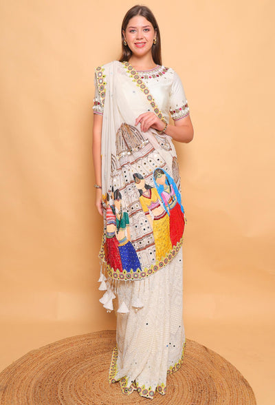 Woman wearing a saree with a colorful design on a beige background