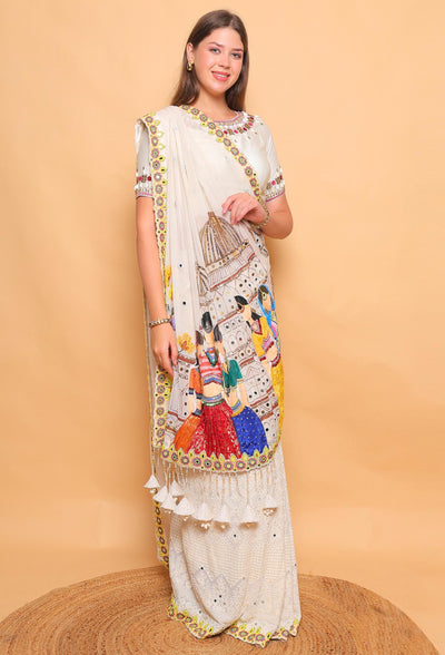 Woman wearing a traditional embroidered saree against a beige background
