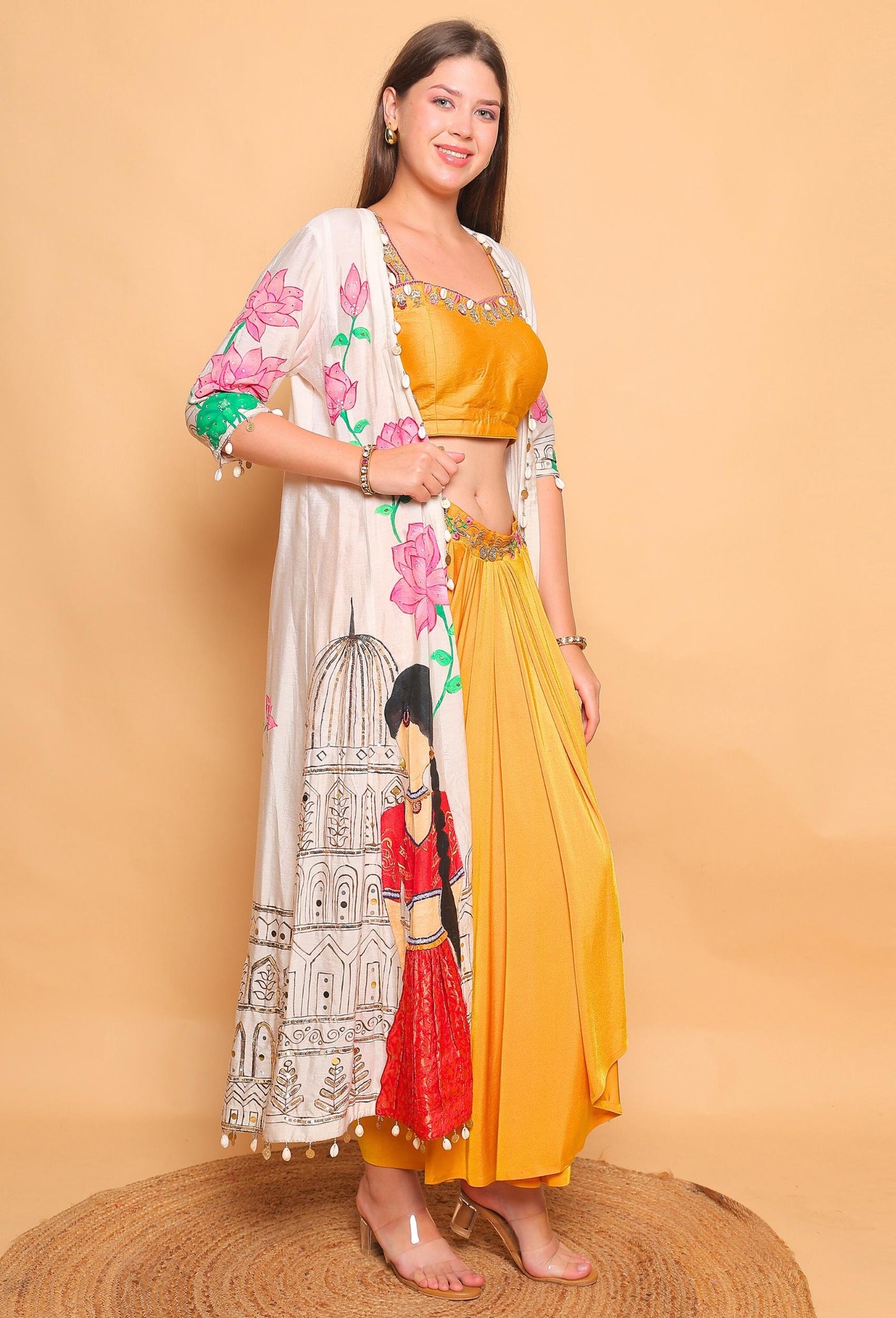 Woman wearing a traditional outfit with a floral top and yellow skirt on a beige background