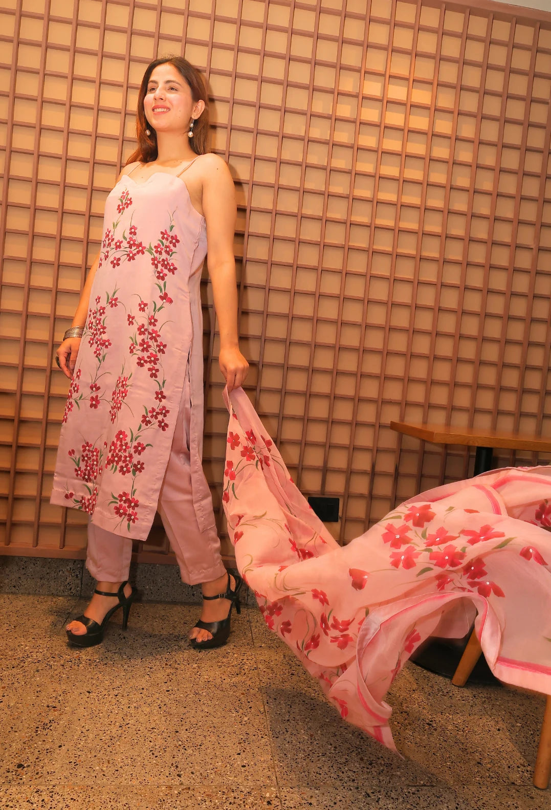Experience the beauty of nature with Floral Desire. This hand painted and hand embroidered suit features a stunning floral design on imported armani satin fabric. With a delicate noodle strap neckline, this suit is a true masterpiece from designer brand Destiny by Anjali. Elevate your style and embrace the art of nature.